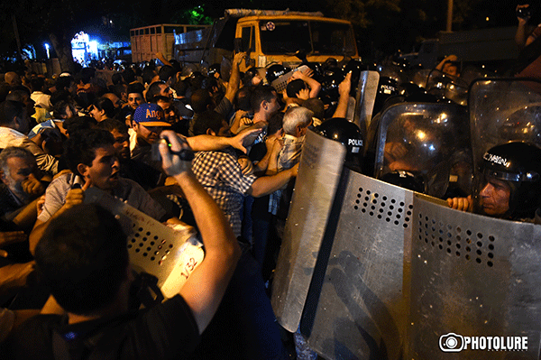 Live: clashes between police and protesters.
