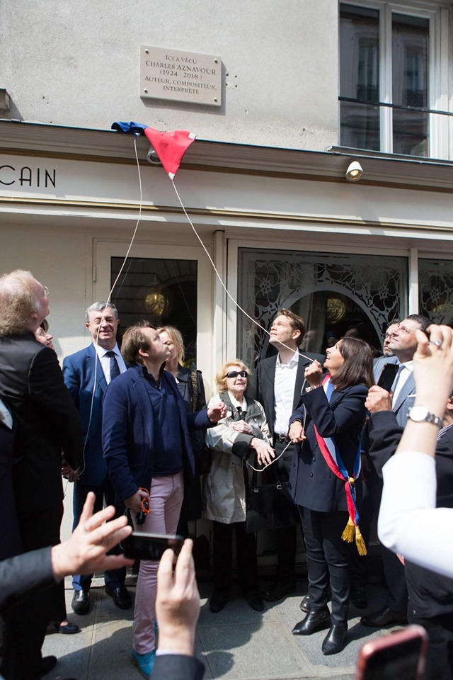 Charles Aznavour memorial plaque inaugurated at first Paris apartment building of Aznavour family