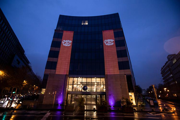 The EEAS headquarters in Brussels, lit up in orange to mark the date.
