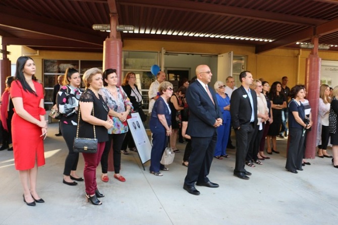 Ambassador Dr. Armen Baibourtian (center) standing with audience at opening ceremonies