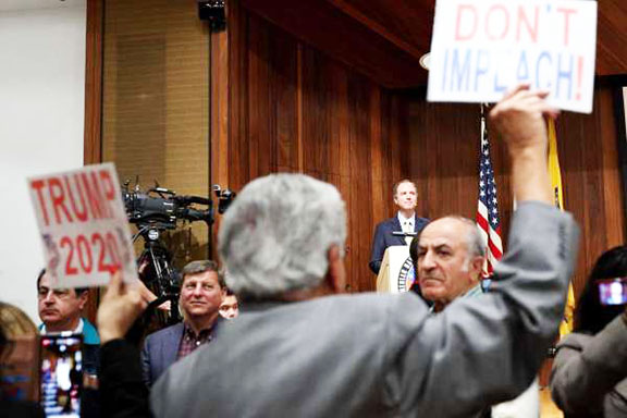 During scuffle at town hall, anti-impeachment protesters join Turks in insulting Genocide victims