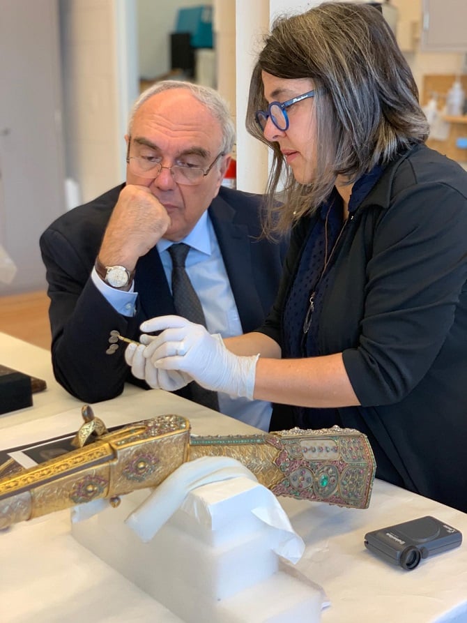Prof. Dr. Chookaszian, the Chair of Armenian Art History and Theory at Yerevan State University (left) and Julie Lauffenburger, and Director of Conservation at the Walters Art Museum (right), amid inspections of the bejeweled gun.