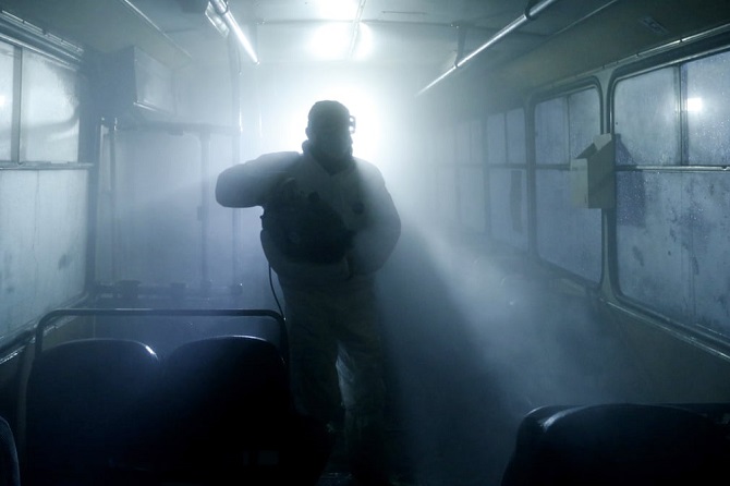 Photo of a man disinfecting bus in Yerevan makes it to The Guardian’s list of best pictures