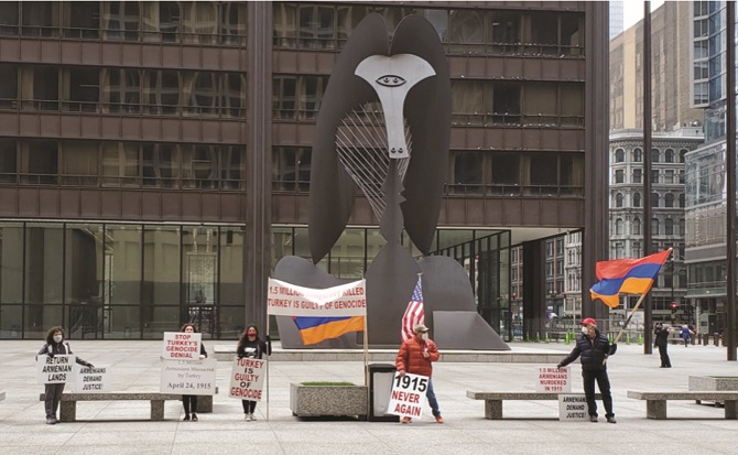 Protesters led by the Chicago ARF standing in front of the famed Picasso sculpture in Daley Plaza in downtown Chicago, Illinois, April 24, 2020