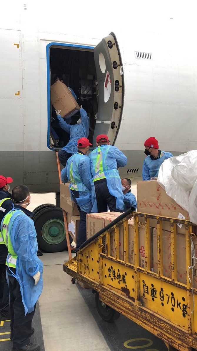 Supplies from China being loaded onto a plane for Armenia