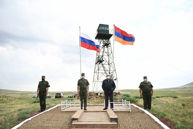 State flags of Armenia and Russia waving on the border symbolize our friendly relations