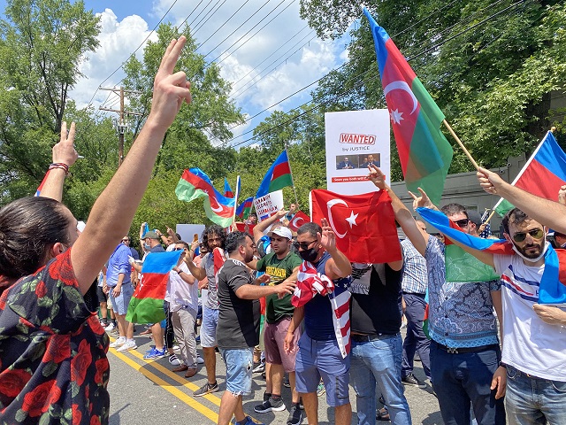 Armenians want peace. Azerbaijan wants war: As AYF Washington DC Chair Alex Manoukian’s peace sign was met with Azerbaijani/Turkish “Grey Wolves” terrorist signs. Photo: Kristine Antanesian