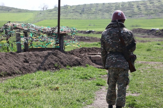 Azerbaijani forces use mortars as they shell Armenian positions located in Yeraskh section of the border