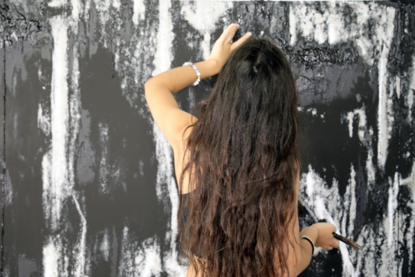 Joanna Nanajian painting with charcoal