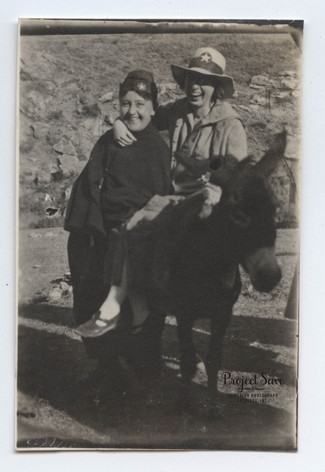 Two unidentified young women posing with a donkey. The Near East Relief star is visible on their hats. Sivas, Turkey, 1919, photographer unknown. Courtesy of Lucina Thompson Beeching