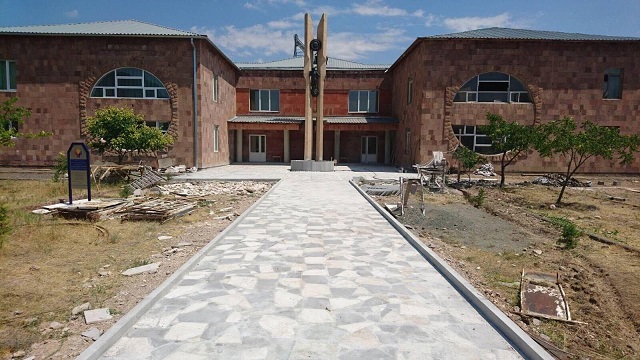 The primary school in Paruyr Sevak with new exterior work beginning. This is a new entrance and walkway/plaza that will soon be a community park and playground. The mason work is the first phase. The interior work is complete and includes four new classrooms, a cultural auditorium, large fully furnished kitchen, new central heating and interior hallways. Furnishings for the classrooms are complete. (Photo captured last week, provided by Stepan Piligian)