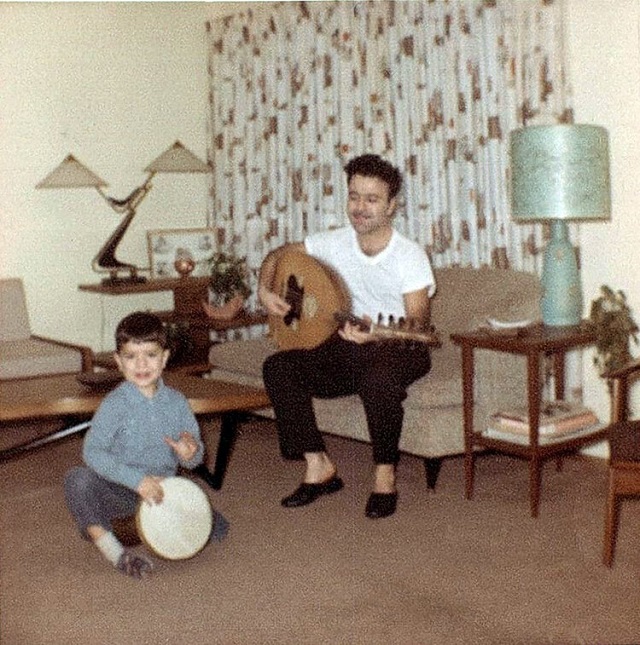 Ara Dinkjian as a child playing with his father, Onnik Dinkjian
