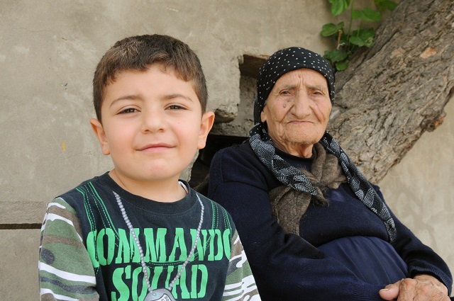 Woman with grandson in Martakert. Photo (c) 2020 Matthew Karanian