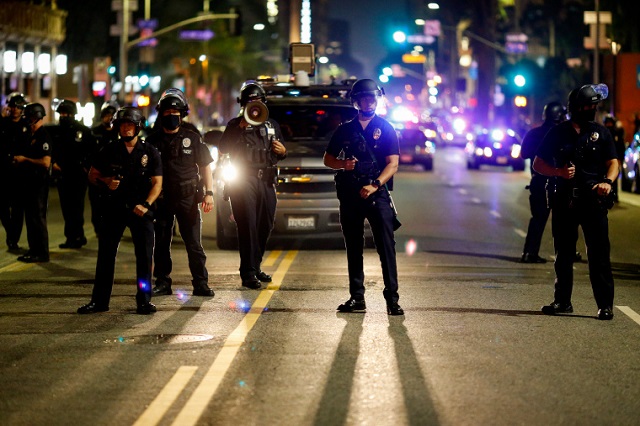 Los Angeles police arrest, charge 2 reporters documenting social justice protest