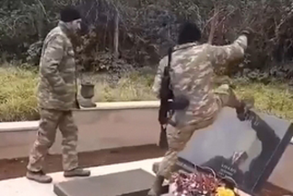 Azeri troopsfilmed toppling, destroying Armenian tombstones