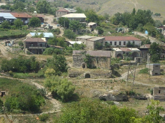 Azerbaijanis carrying white flags attempt to approach Armenian side