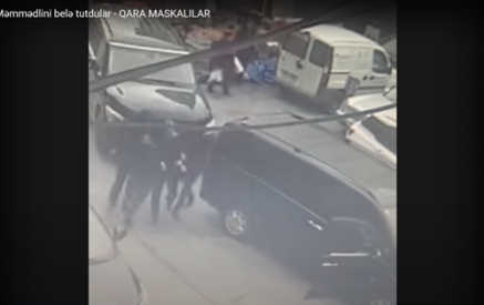 Azerbaijani police raid Toplum TV, detain journalists over alleged currency smuggling